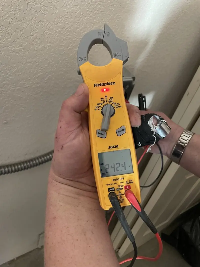 Voltage testing with clamp meter during Recessed Lighting Installation in Bellevue